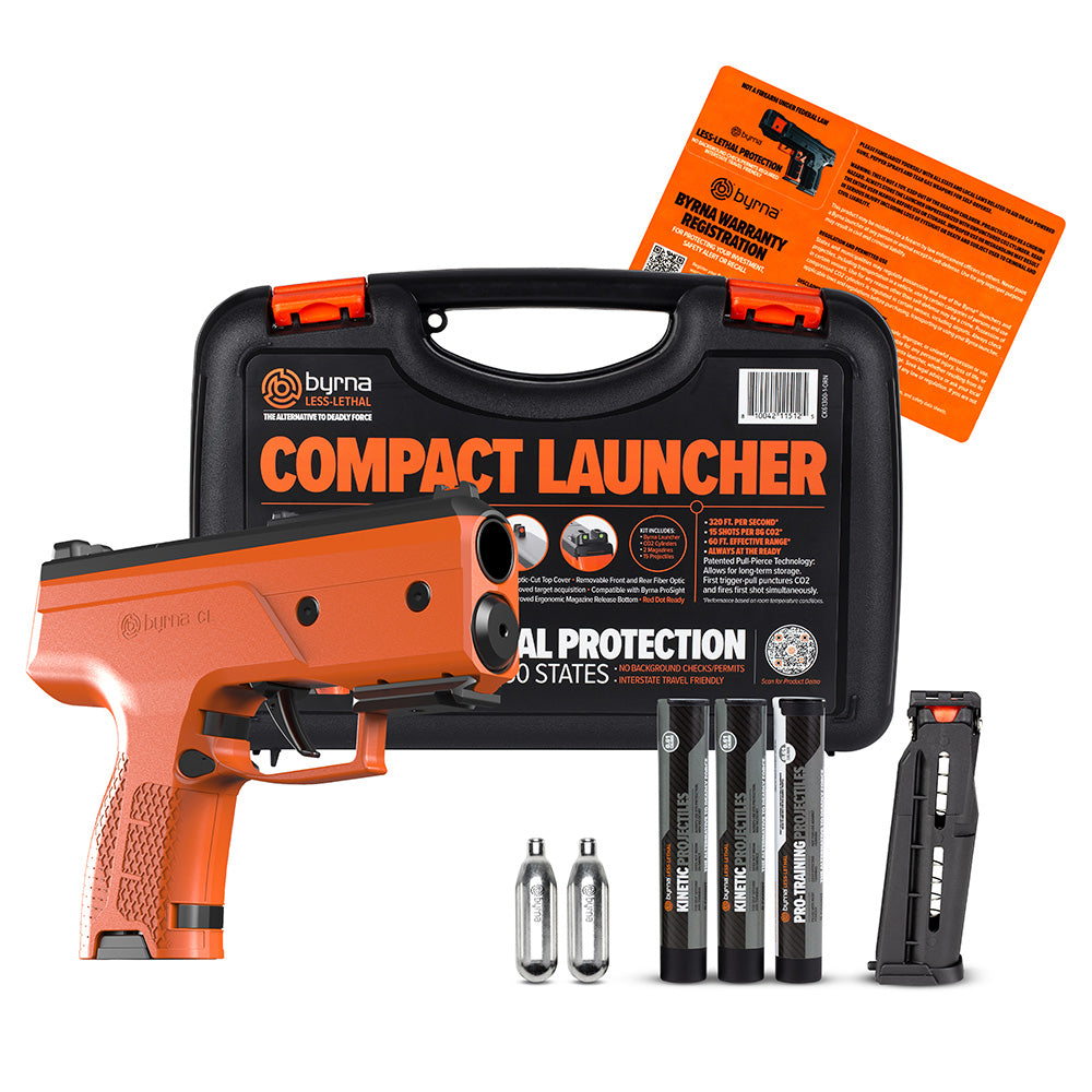 Byrna Compact launcher with accessories and Byrna packaging on a white background