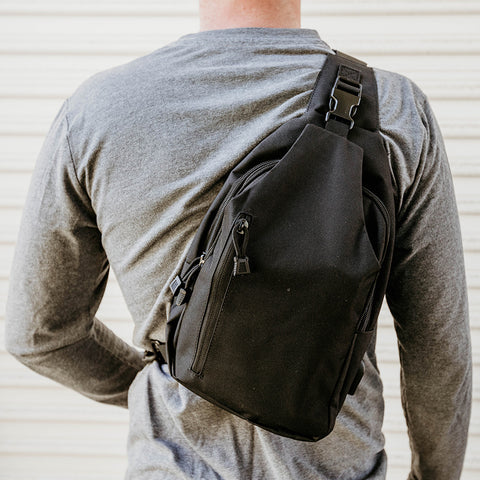 Back Profile of Model wearing Byrna Concealed Carry Sling Bag 