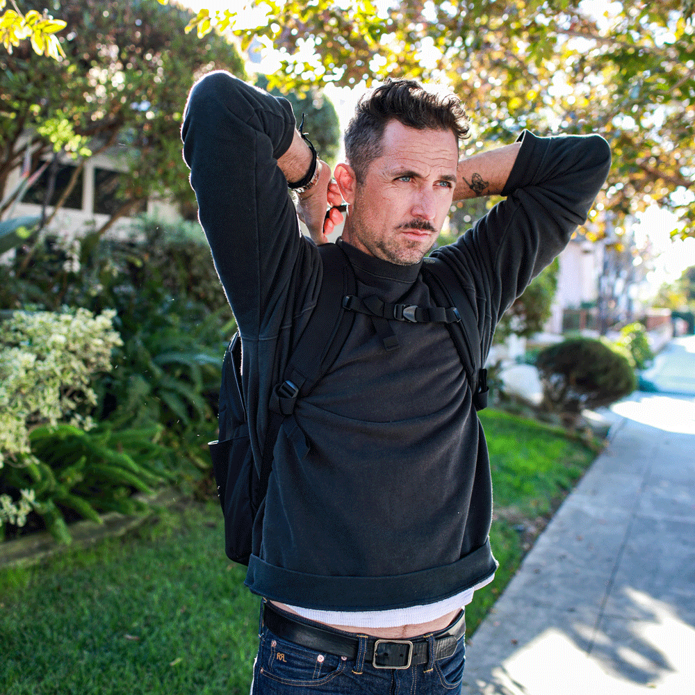 Byrna Ballistipac Basic - Black [NO FRONT MOLLE] Front profile of model deploying black ballistipac GIF